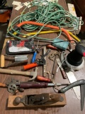 Table full of tools, handsaw?s, antique planet, Car buffer, large electric cord, see pics