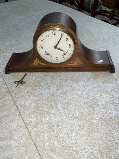 Vintage Plymouth working clock with key and beautiful inlaid base.