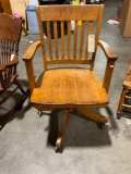 Vintage tiger oak office chair on rollers. Made by Crocker share company Sheboygan Wisconsin