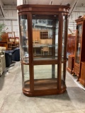 Gorgeous solid wood lighted curio W/rounded glass opening corner doors and beveled Glass back