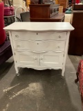 Antique bedroom dresser on casters, has been repainted egg shell white with new pulls
