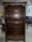 Stately and ornate solid wood bookcase with adjustable shelves and lower drawer