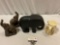 4 pc. lot of elephant decor; bookends, wood carved, candle, approx 11 x 8 x 4 in.