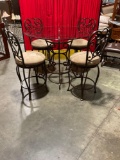 Beautiful solid and heavy wrought iron, glass top Bistro or kitchen table with four swivel chairs