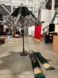 2x like new garden treasures Patio umbrellas W/one stand. Both come with storage bag