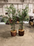 Pair of faux bamboo trees in wicker planter baskets both about 7 foot tall