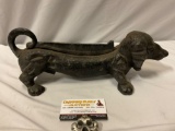 Antiqued cast iron wiener dog door stop, approx 14 x 5 x 5 in.