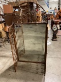 Antiqued metal framed wall mount mirror with metal gates, embellished w/ Fleur-de-lis