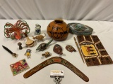 Mixed lot of native / ethnic handmade collectibles from around the world; stone animals, boomerang