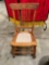 Vintage smaller wooden rocking chair With center upholstered piece