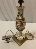 Antique porcelain lamp w/ female figure design, shows / damage / repair, cord is cut, sold as is