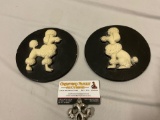 2 pc. lot of round composite poodle art pieces, approx 6 in.