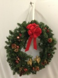 vintage faux Christmas door hanging wreath with bell and angel figures, approx 20 x 22 in. INV 2221