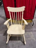 Antique wooden rocking chair painted yellow