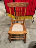 Vintage smaller wooden rocking chair With center upholstered piece