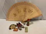 Mixed lot of ethnic collectibles; shoes, purse, large wood fan, doll & more.