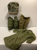 5 pc. lot of vintage US military medium size trench coat, bed rolls, waxed bag, back pack