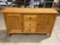 Solid tiger oak mission style credenza , featuring 2 shelved cabinets , 3 drawers, 1 for silverware