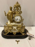 Large antique French mantle clock w/ ornate female figure design w/ key & wood base, sold as is