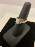 Gorgeous 14K marked gold ring with opal stone, size 7. Weighs 3.7 g.