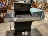 Gently used charbroiler gas barbecue grill W/utensils and 5 gallon propane tank