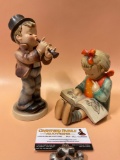 2 pc. lot Vintage Goebel M.I. Hummel figurines, approx 5 x 8 in. Horn player is repaired.