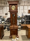 Beautiful antique grandfathers clock, incased in a stunning ornately carved wood cabinet