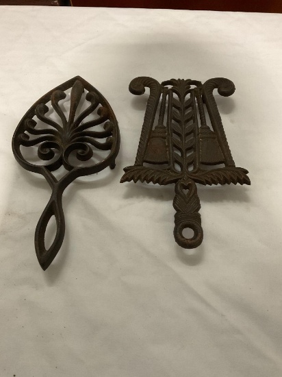 Pair of antique cast-iron trivets