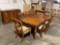 Nice matching set of Tiger oak Ashley furniture including dining table and chairs, credenza buffet,