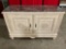Large wooden dresser-style cabinet with marble top