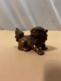 very finally carved Asian boxwood Netsuke figure of guardian lion / foo lion, approx 2 x 1.5 in.