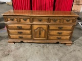 Large wooden 12-drawer dresser with interior sliding shelves