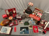 Huge lot of vintage Coca-Cola brand collectibles; glass pitcher, paper collection, football, trivet,