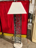 Very nice wrought iron standing lamp with trapezoidal shade and circular base.