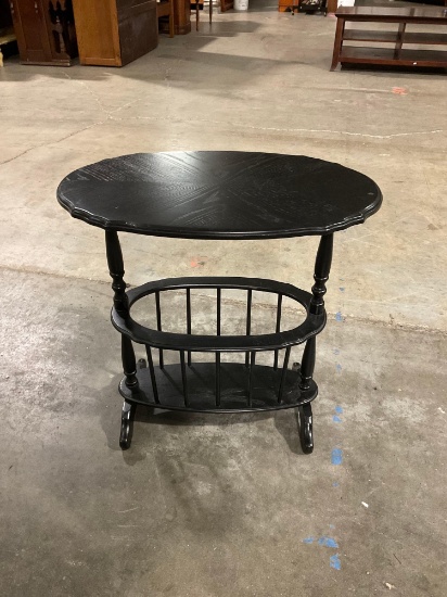 Cute black side / accent table with media storage area.