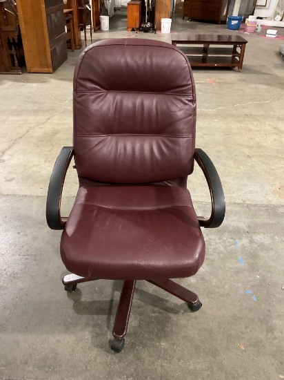 Burgundy Executive swiveling/rolling office chair with mahogany accents by the HON Company.
