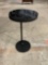 Black accent table / plant stand with swiveling top surface.