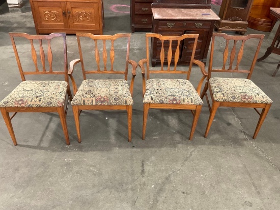 Set of 4 Oak Chairs with woven floral design seat cushions.