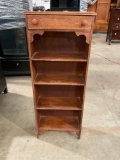 Slender Oak shelving unit / bookcase with single drawer.