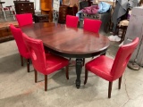 Wooden Dining table with 2 removable leaves and 6 chairs.