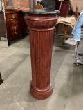 Column style pedestal accent table / plant stand with interior storage.