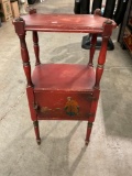 Solid wood accent table with storage and Asian-themed painting.