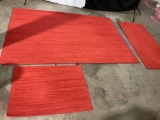 RED FLOOR RUG SET OF 3 INDIVIDUAL PIECES AND SIZES.