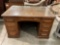 Beautiful Antique Tiger Oak Desk with Dovetail drawers and glass top.