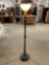 Vintage wooden torchiere style floor lamp with white glass half globe shade.