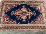 BEAUTIFUL AREA RUG WITH NICE FRINGES.