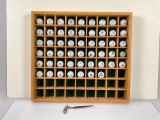 collection of golf balls from different courses around the USA. comes in wooden display case