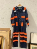 Lot of 8 used Aramark 56R safety jumpsuits, with orange reflectors.