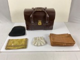 Vintage leather briefcase and assortment of smaller bags.