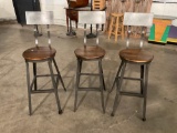 Set of 3 Bar stools with metal frames and beautiful wooden seats.